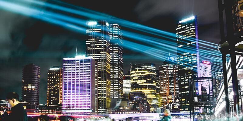A city with buildings lit up at night