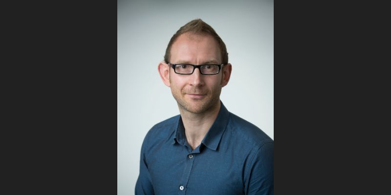 A headshot of Dr Mark Hopkins