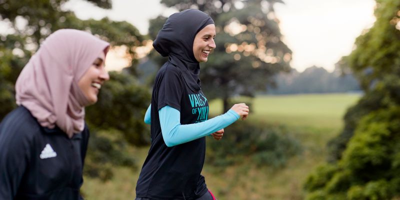 Namrah Shahid, founder of Hijabi Runners, running with a friend.
