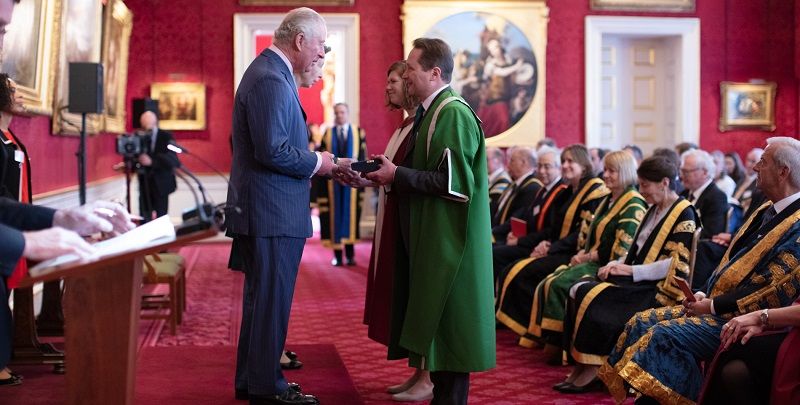 Prince Charles and Princess Anne present Professor Nick Plant and Dr Amanda Maycock with the Queen's Anniversary Prize