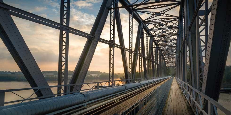 The view from an iron rail bridge at sunset