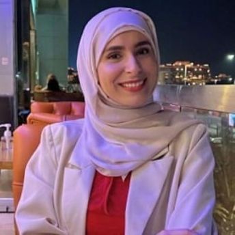 A headshot of Hadeel smiling at the camera.