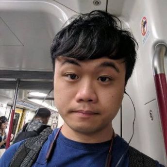 A headshot of Hoi Fai Yu looking at the camera.