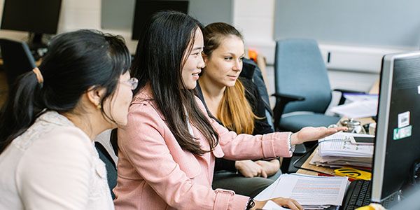 Researchers working together at a desk
