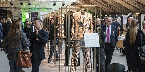 People browsing textiles as part of Future Fashion Factory
