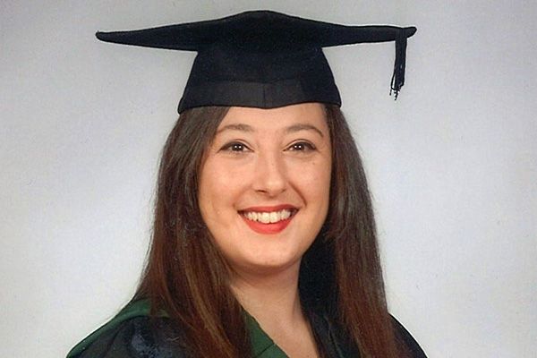 Portrait of Robina in graduation dress.