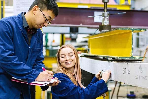 Two engineering students working together.